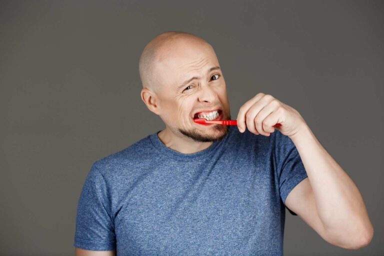 Illustration showing bleeding gums while brushing teeth, highlighting common causes, symptoms, and treatment options.