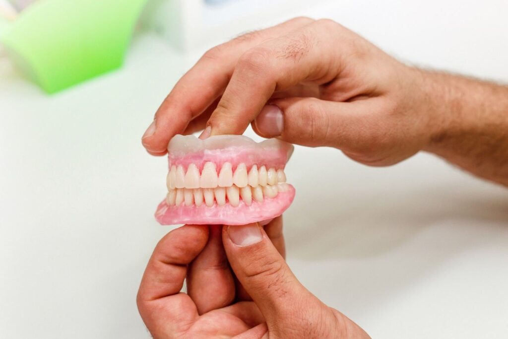 Modern false teeth dentures showing a natural-looking artificial smile